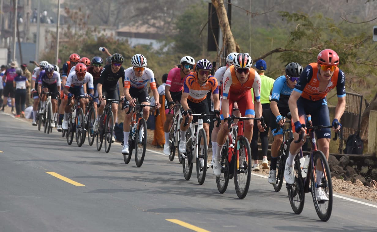 Pune Grand Tour 2026 Stage 2 race on Sinhagad Road with cyclists competing for yellow jersey